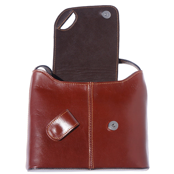 Patent shoulder bag with fold over flap closure and magnetic closure